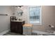 Bright bathroom featuring a vanity, large mirror, modern fixtures, and natural light from the window at 3155 Ramseur St, Lincolnton, NC 28092