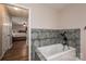 Elegant bathroom featuring a luxurious tub with a stylish faucet and tiled surround at 3155 Ramseur St, Lincolnton, NC 28092