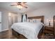 Inviting bedroom featuring wood-look floors, a ceiling fan, and a window for ample natural light at 3155 Ramseur St, Lincolnton, NC 28092