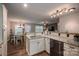 Modern kitchen with stainless steel appliances and granite countertops, connected to the dining and living areas at 3155 Ramseur St, Lincolnton, NC 28092