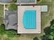 Aerial overhead of the pool and clubhouse. There are sun loungers and umbrellas scattered around the pool area at 325 Ox Bow Cir, Mount Holly, NC 28120