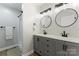 Modern bathroom featuring dual sinks, contemporary fixtures, and a walk-in shower at 325 Spring Oak Dr, Salisbury, NC 28147