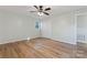 Bedroom featuring wood-look floors, a ceiling fan, and closet space at 325 Spring Oak Dr, Salisbury, NC 28147