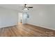 Bright bedroom featuring wood-look floors and an en-suite bathroom at 325 Spring Oak Dr, Salisbury, NC 28147