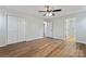 Bedroom featuring wood-look floors, a ceiling fan, and closet space at 325 Spring Oak Dr, Salisbury, NC 28147