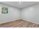 Bright bedroom featuring wood-look floors and a window at 325 Spring Oak Dr, Salisbury, NC 28147