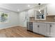 Bright eat-in kitchen featuring stainless appliances, white cabinets, and a white countertop at 325 Spring Oak Dr, Salisbury, NC 28147