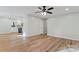 Spacious living room featuring wood-look floors, light-colored walls, and an open floor plan at 325 Spring Oak Dr, Salisbury, NC 28147