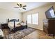 Neutral bedroom features hardwood floors, natural light, and classic furniture, creating a serene space at 330 Chinquapin Ln, Mt Ulla, NC 28125