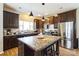 Eat-in kitchen features a kitchen island, stainless steel appliances and dark cabinetry at 330 Chinquapin Ln, Mt Ulla, NC 28125