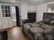 Bedroom with a modern bed set, wooden floors, and a bright window at 348 Grice St, Shelby, NC 28150