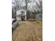 View of the home's exterior showing the front yard, white siding and landscaping at 348 Grice St, Shelby, NC 28150