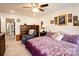 Cozy bedroom featuring a ceiling fan, wood dresser and a comfortable recliner at 3941 Rothwood Ln, Harrisburg, NC 28075