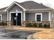 Office building with stone accents, gray siding, and reserved parking at 3941 Rothwood Ln, Harrisburg, NC 28075