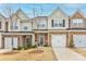 Charming townhome with a one-car garage, brick accents, and a well-manicured lawn in a Gathering-friendly neighborhood at 3941 Rothwood Ln, Harrisburg, NC 28075