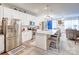 Contemporary kitchen featuring stainless steel appliances, a spacious island with seating, and abundant natural light at 3941 Rothwood Ln, Harrisburg, NC 28075