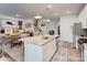 Modern kitchen featuring a large island, granite countertops, stainless steel appliances, and ample cabinet space at 3941 Rothwood Ln, Harrisburg, NC 28075