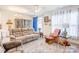 Inviting living room featuring a comfortable sofa, stylish accents, and a bright window creating a warm and welcoming atmosphere at 3941 Rothwood Ln, Harrisburg, NC 28075