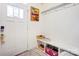 Well-organized mud room with built-in bench, hooks, and storage cubbies at 3941 Rothwood Ln, Harrisburg, NC 28075