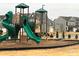 Community playground with slides, climbing structures, and green turf at 3941 Rothwood Ln, Harrisburg, NC 28075