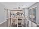 Dining area open to kitchen with hardwood floors and modern lighting at 4007 Hermes Ln, Waxhaw, NC 28173