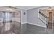 Inviting foyer with staircase, neutral paint, and wood-look floors at 4007 Hermes Ln, Waxhaw, NC 28173