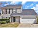 Classic home exterior showing well-manicured lawn and attractive architectural details at 4007 Hermes Ln, Waxhaw, NC 28173