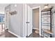 Hallway with a peek into a bathroom and hooks for storage and organization at 4007 Hermes Ln, Waxhaw, NC 28173