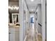 Hallway with views into other rooms, hardwood floors and neutral paint at 4007 Hermes Ln, Waxhaw, NC 28173