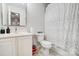 Practical bathroom with a white vanity, toilet, and shower, designed for functionality and ease of use at 405 Goldstaff Ln, Charlotte, NC 28273