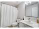 Well-lit bathroom with a shower, white vanity, and coordinated fixtures offers a clean and functional space at 405 Goldstaff Ln, Charlotte, NC 28273