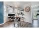 Bright dining area features a modern chandelier, desk/work area and cozy breakfast bar at 405 Goldstaff Ln, Charlotte, NC 28273