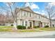 Charming townhouse with a well-manicured lawn, complemented by blooming trees at 405 Goldstaff Ln, Charlotte, NC 28273