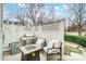 Cozy outdoor patio with a grill, comfortable seating, and privacy fencing, ideal for relaxing and entertaining at 405 Goldstaff Ln, Charlotte, NC 28273