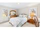 Bright bedroom with two windows, a bed, and dresser at 424 Virginia Ave, Statesville, NC 28677