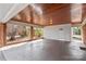 Carport with wood ceiling and red brick accent walls at 424 Virginia Ave, Statesville, NC 28677