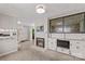 Spacious living room with a brick fireplace, built-in shelving, adjacent to the kitchen at 424 Virginia Ave, Statesville, NC 28677