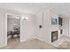 Inviting living room with a fireplace, leading to the dining area with a table and chairs at 424 Virginia Ave, Statesville, NC 28677