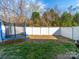 Backyard with a trampoline and privacy fence; partially grass and partially mulch at 430 Battery Cir, Clover, SC 29710