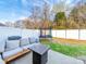 Backyard patio featuring a trampoline, seating, a modern fire pit, and a white privacy fence at 430 Battery Cir, Clover, SC 29710