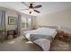 Bright bedroom features a ceiling fan, natural light, and carpet at 430 Battery Cir, Clover, SC 29710