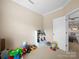 Bedroom filled with toys and an open doorway to the living area at 430 Battery Cir, Clover, SC 29710