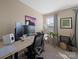 Bedroom area with a functional computer desk setup and natural light at 430 Battery Cir, Clover, SC 29710