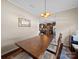 Bright dining room features wooden table and view of the kitchen in the distance at 430 Battery Cir, Clover, SC 29710