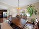 Bright dining room features wooden table, bench seating, and natural light from large windows at 430 Battery Cir, Clover, SC 29710