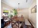 Bright dining room features wooden table, bench seating, and natural light from large windows at 430 Battery Cir, Clover, SC 29710