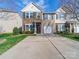 Charming two-story home featuring a stone facade, attached garage, and well-manicured front lawn on a sunny day at 430 Battery Cir, Clover, SC 29710