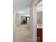 Hallway leading to the bathroom and home office features carpet floors and neutral walls at 430 Battery Cir, Clover, SC 29710