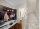 Mudroom with storage bench, beadboard accent, staircase, and view of bathroom at 430 Battery Cir, Clover, SC 29710