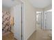 Hallway with carpet floors and a view of the bathroom and bedroom doors at 430 Battery Cir, Clover, SC 29710